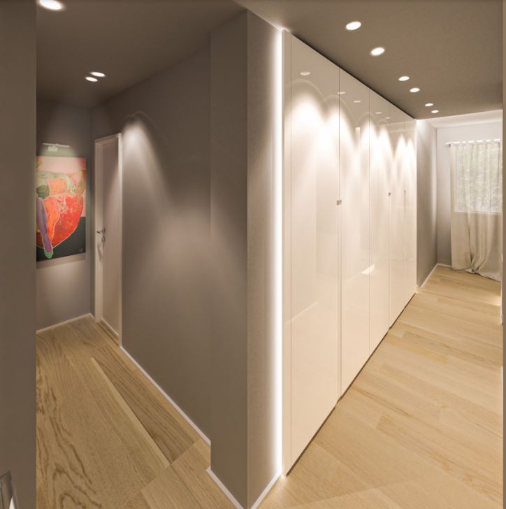 IL CORRIDOIO ALTERNATIVO – MICHELE VOLPI STUDIO INTERIOR DESIGN un corridoio caratterizzato da armadi contenitori, con strip led sui montanti e da pareti grigio scure per ottenere l'effetto galleria d'arte